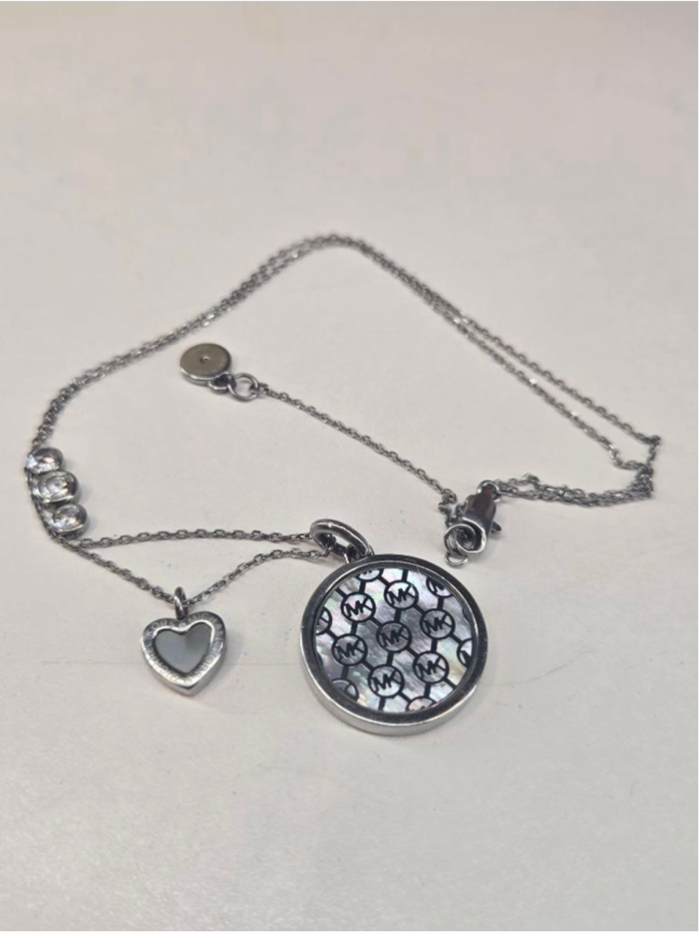 Michael Kors Necklace Silvertone MK Monogram Mother of Pearl Heart Charm Crystal